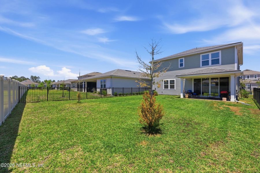 Exterior details and patio area of a home in Tributary, Yulee (Image 23).
