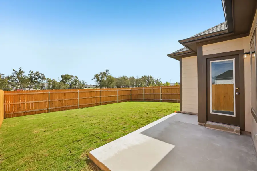 Exterior details and patio area of a home in Trinity Ranch, Elgin (Image 19).