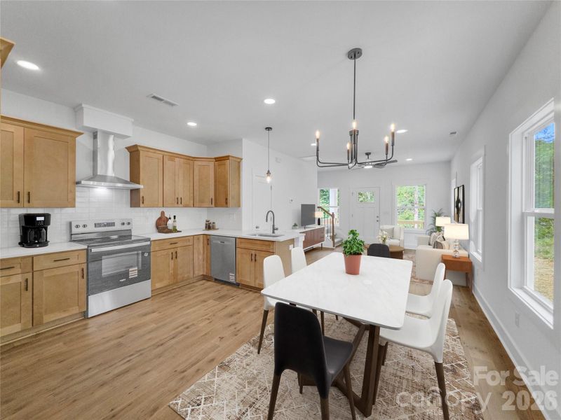 Dining area and kitchen*virtually staged Dining area and kitchen*virtually staged