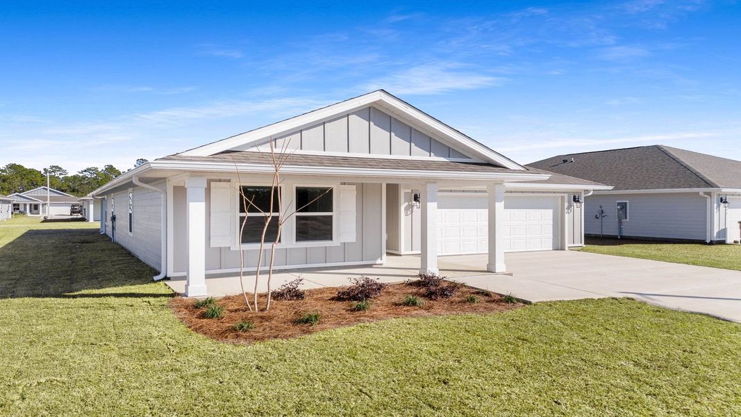 Front exterior of a new home in Palmetto Bluff, Port Saint Joe, FL, highlighting curb appeal (Image 2). Front exterior of a new home in Palmetto Bluff, Port Saint Joe, FL, highlighting curb appeal (Image 2).