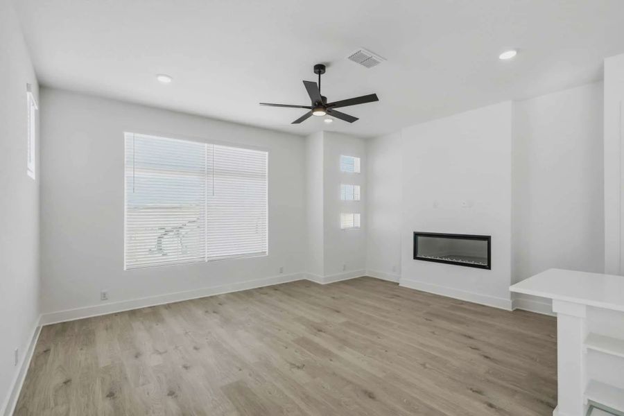 Representative unfurnished interior of a home built from the Calypso by Chesmar Homes in Prominence Urban, San Antonio (Image 15).