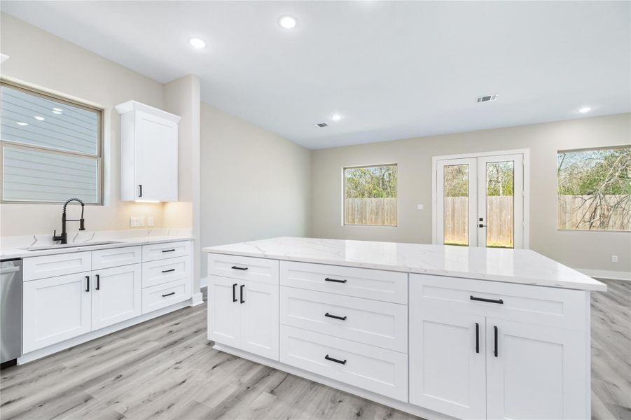 With pots and pans drawers, expansive cabinetry, and the large center island, your new home offers ample storage and plenty of space to prepare and enjoy meals with ease.