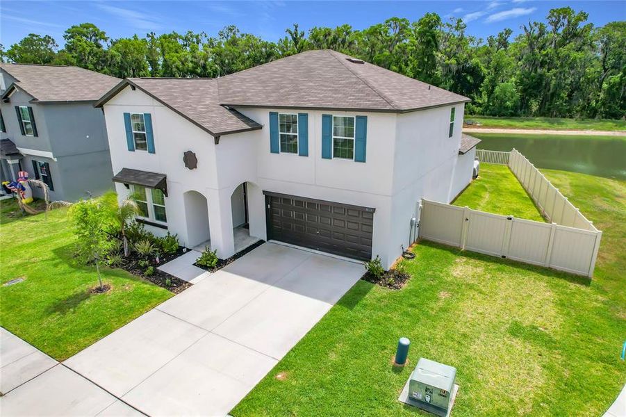 Front exterior of a new home in , Lakeland, FL, highlighting curb appeal (Image 26).