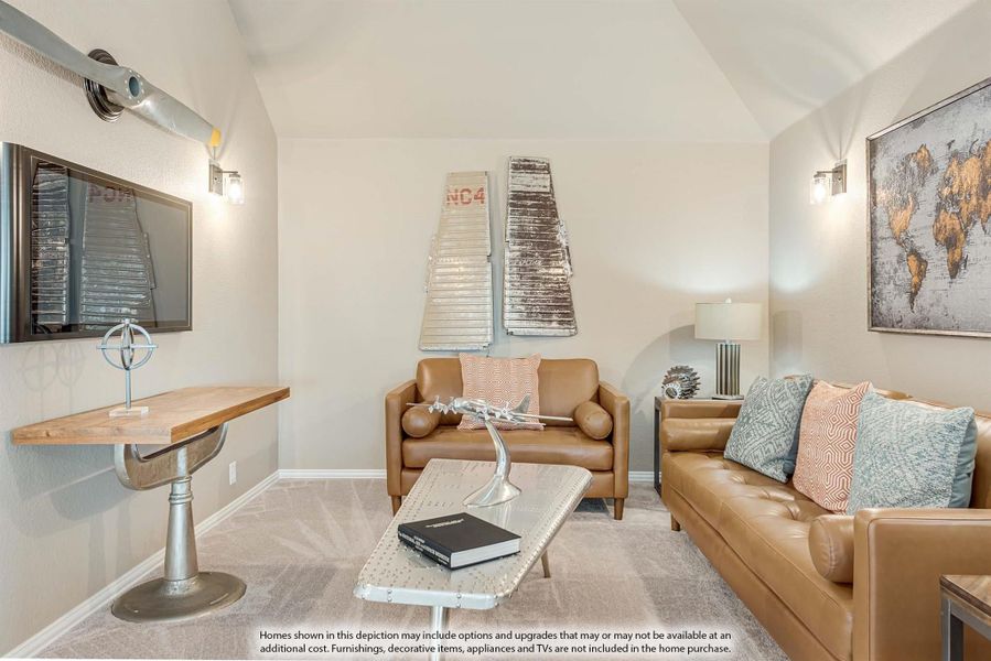 Living room with vaulted ceiling, tan leather sofa, wall-mounted TV, and aviation-themed decor