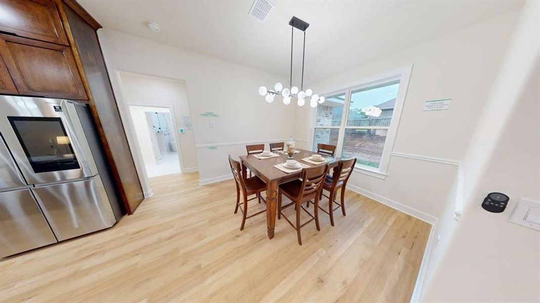Dining area featuring light wood-type flooring