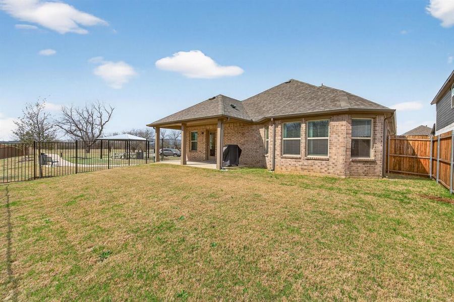 Exterior details and patio area of a home in Sagebrook, Denton (Image 24).