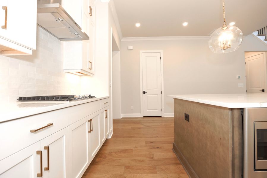 Representative furnished interior of a home built from the The Maddox by The Providence Group in Bellmoore Park, Johns Creek (Image 12).