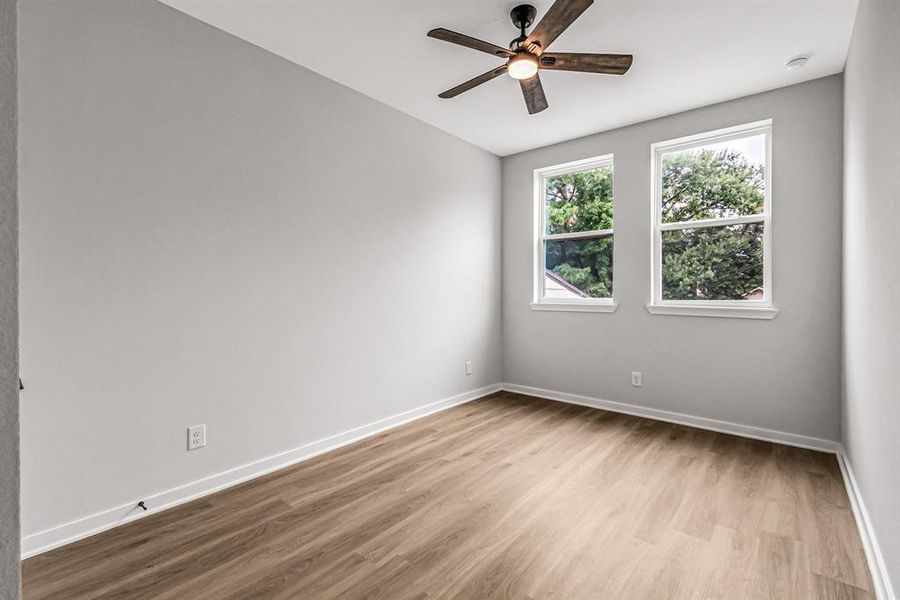 One of the two guest bedrooms on the second floor.