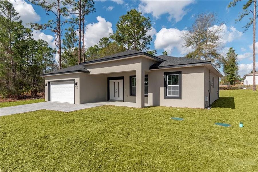 Front exterior of a new home in , Citrus Springs, FL, highlighting curb appeal (Image 31).