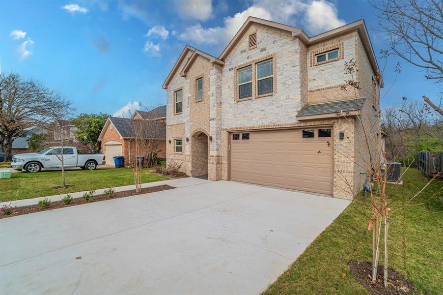 Front exterior of a new home in , Dallas, TX, highlighting curb appeal (Image 20).