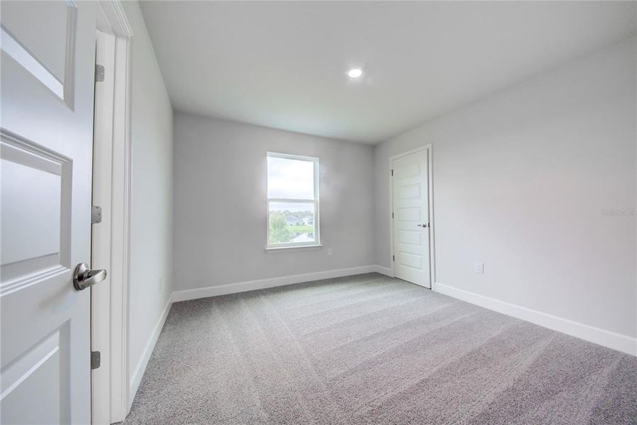 Spacious, unfurnished interior of a new home in Aviary at Rutland Ranch, Parrish (Image 23).