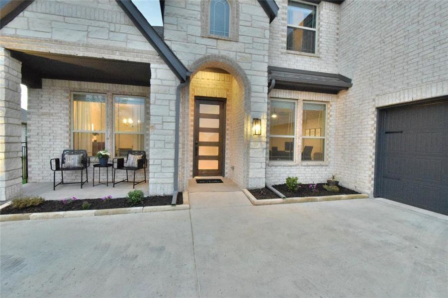 Exterior details and patio area of a home in Abe's Landing, Granbury (Image 20).