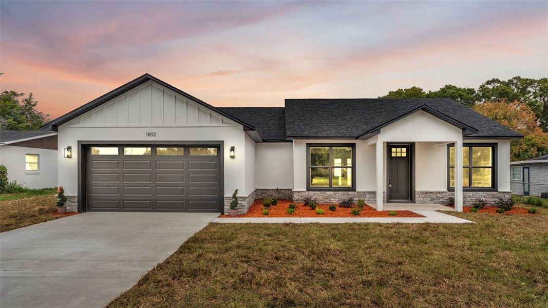 Front exterior of a new home in , Winter Haven, FL, highlighting curb appeal (Image 2). Front exterior of a new home in , Winter Haven, FL, highlighting curb appeal (Image 2).