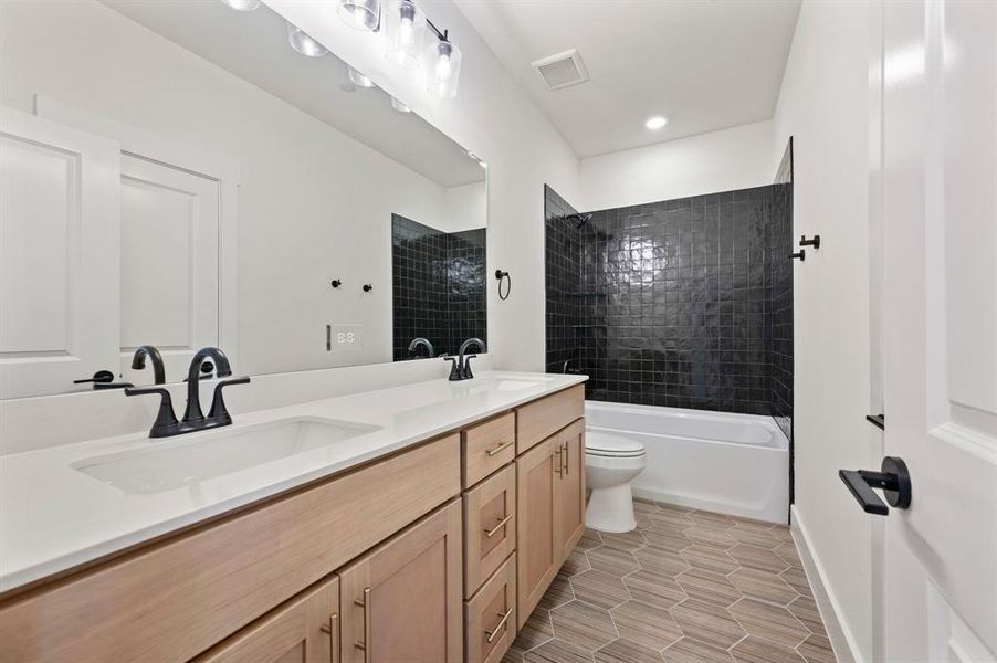 Friends and family will enjoy having their own vanity space in this lovely guest bath! Friends and family will enjoy having their own vanity space in this lovely guest bath!