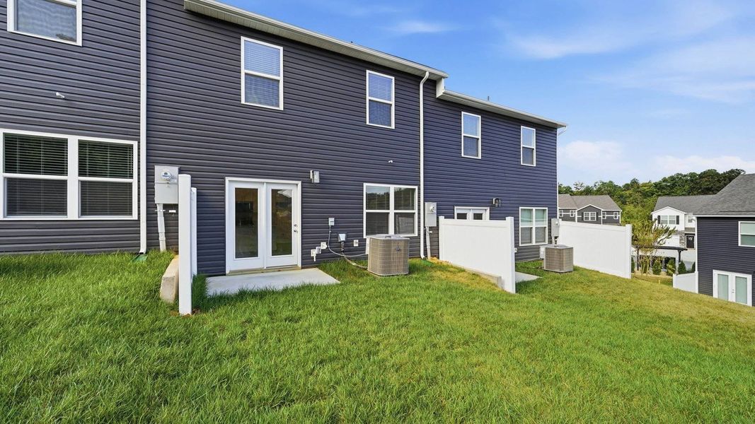 Exterior details and patio area of a home in The Arbor Townhomes, Kingsport (Image 4).