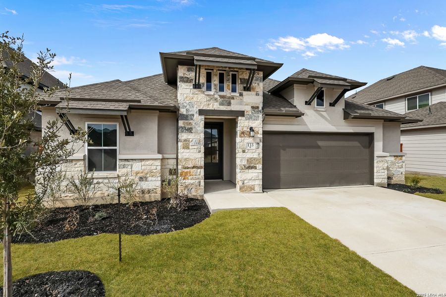 Front exterior of a new home in Megan's Landing, Castroville, TX, highlighting curb appeal (Image 2). Front exterior of a new home in Megan's Landing, Castroville, TX, highlighting curb appeal (Image 2).