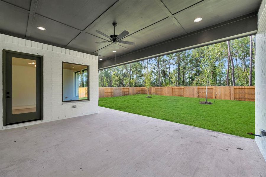 Spacious covered patio. The doors lead to the breakfast room and the gameroom (door further back)