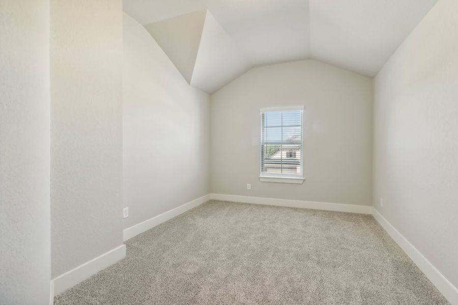 Guest bedroom in the Cedar floorplan at a Meritage Homes community.