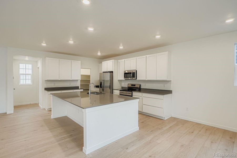 Furnished interior view inside a new home in Parterre, Thornton (Image 9).