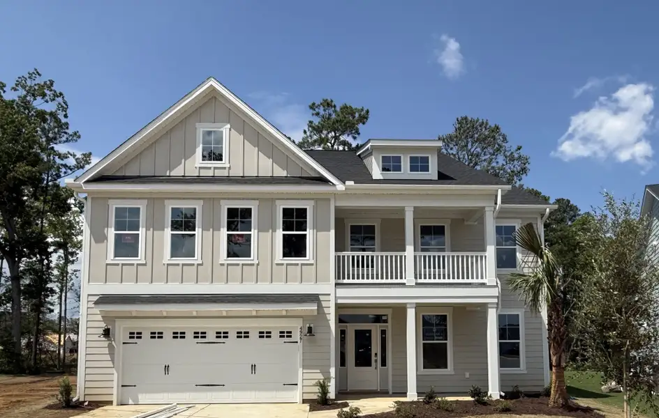 Front exterior of a new home in Grand Park, Leland, NC, highlighting curb appeal (Image 1). Front exterior of a new home in Grand Park, Leland, NC, highlighting curb appeal (Image 1).