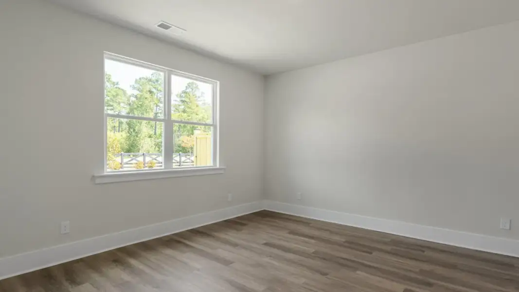 Spacious, unfurnished interior of a new home in The Retreat at Indigo Preserve Townhomes, Leland (Image 20).