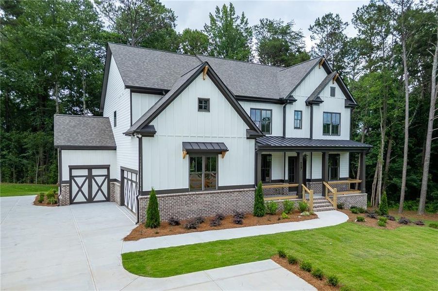 Front exterior of a new home in , Cumming, GA, highlighting curb appeal (Image 25). Front exterior of a new home in , Cumming, GA, highlighting curb appeal (Image 25).