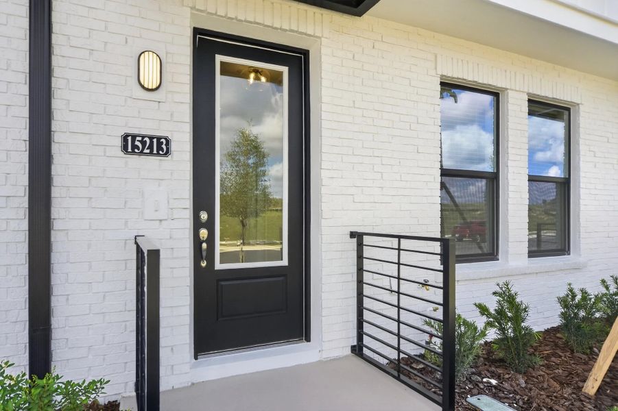 Exterior details and patio area of a home in Parkview at Hamlin, Winter Garden (Image 3).