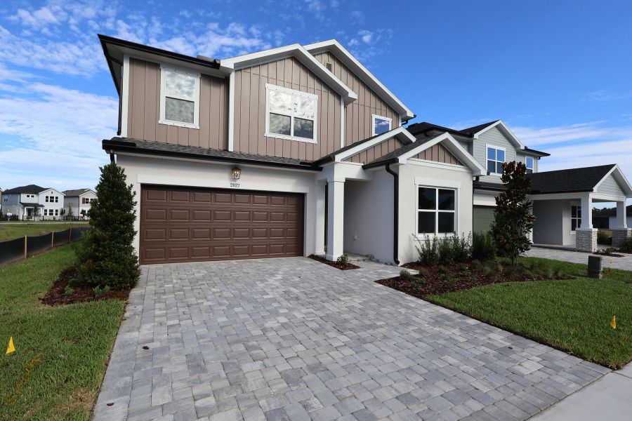 Front exterior of a new home in Soleta at Starkey Ranch – Traditional Series, Odessa, FL, highlighting curb appeal (Image 2). Front exterior of a new home in Soleta at Starkey Ranch – Traditional Series, Odessa, FL, highlighting curb appeal (Image 2).