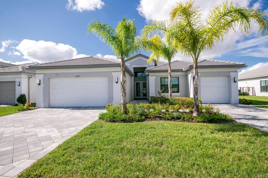 Front exterior of a new home in , Port St. Lucie, FL, highlighting curb appeal (Image 23).