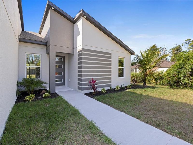 Front exterior of a new home in , Punta Gorda, FL, highlighting curb appeal (Image 20).