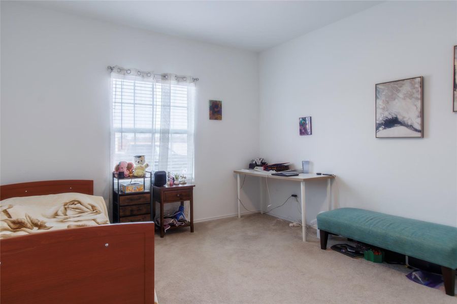 Second generous first-floor suite with direct bathroom access—perfect for guests or multi-generational living.