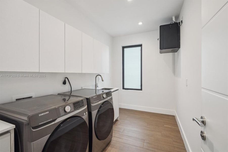 Upstairs Laundry Room with sink