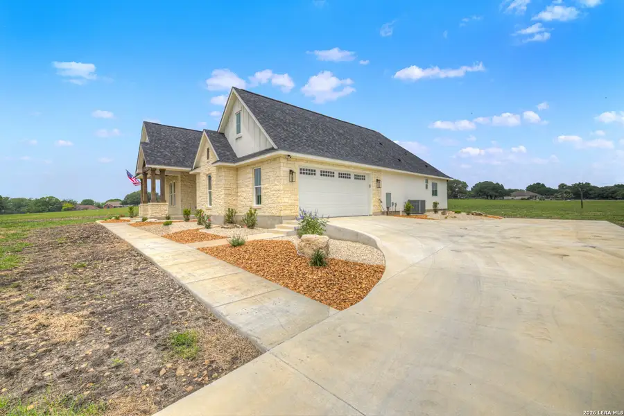 Front exterior of a new home in , Seguin, TX, highlighting curb appeal (Image 28).