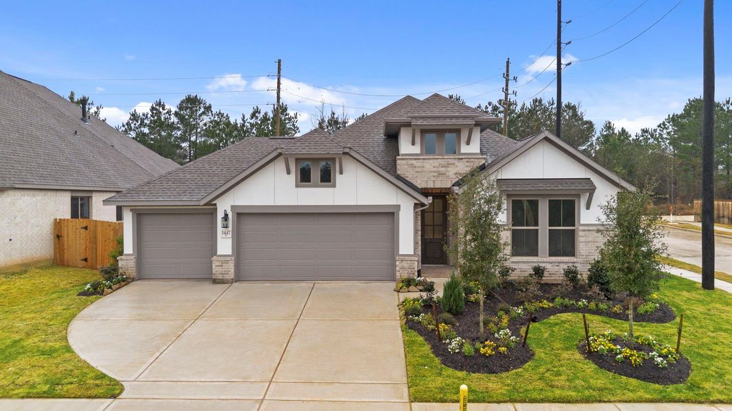 Front exterior of a new home in Escondido, Magnolia, TX, highlighting curb appeal (Image 19).