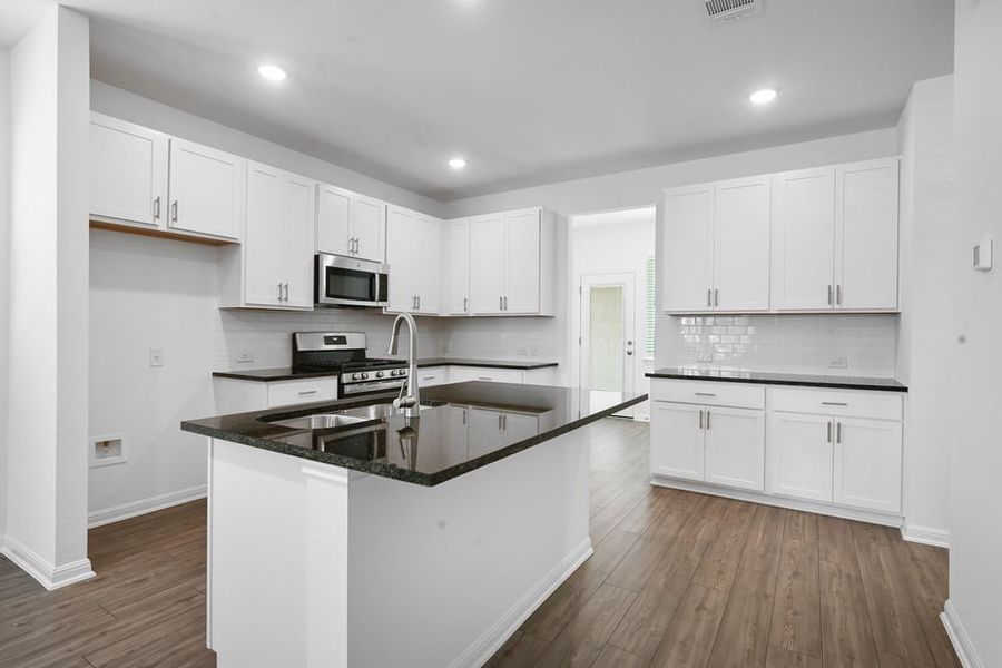 Furnished interior view inside a new home in Emory Crossing 40s, Hutto (Image 4). Furnished interior view inside a new home in Emory Crossing 40s, Hutto (Image 4).