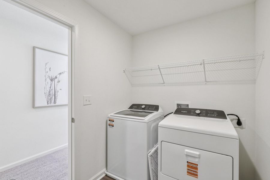 A laundry room with a washer and dryer. A laundry room with a washer and dryer.
