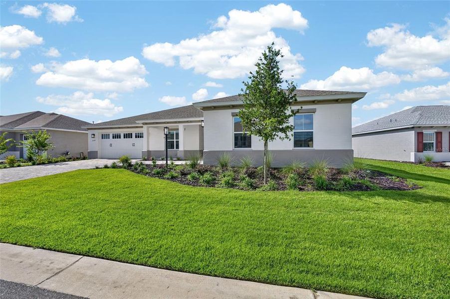 Front exterior of a new home in , Ocala, FL, highlighting curb appeal (Image 27).