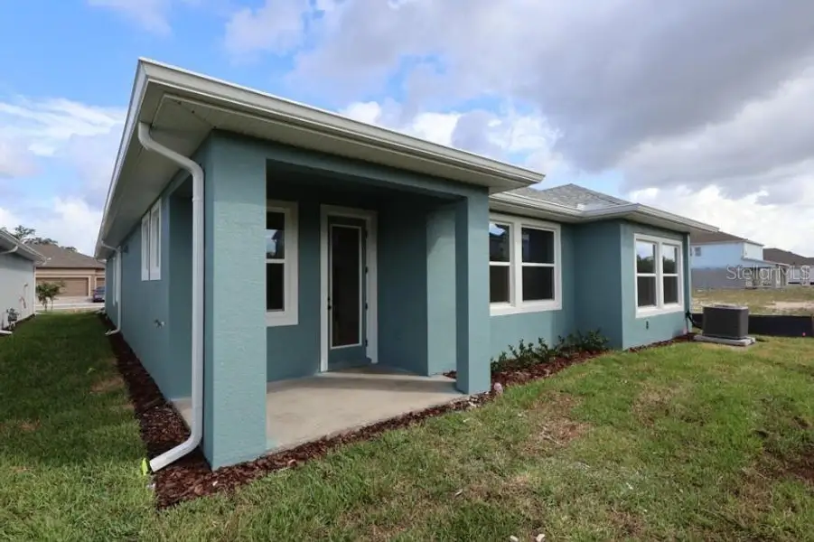 Exterior details and patio area of a home in Waterset Classic Series, Apollo Beach (Image 3).