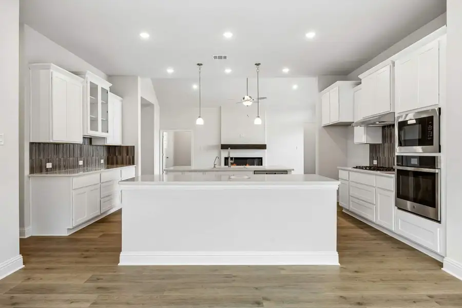 Furnished interior view inside a new home in Oaks of North Grove, Waxahachie (Image 11). Furnished interior view inside a new home in Oaks of North Grove, Waxahachie (Image 11).