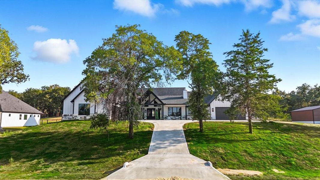 View of front of house with a front lawn and a porch View of front of house with a front lawn and a porch