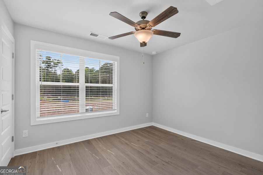 Spacious, unfurnished interior of a new home in The Cottages at East Lanier, Fayetteville (Image 12).