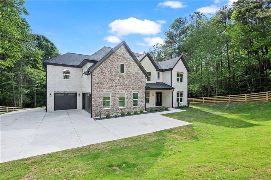 Front exterior of a new home in , Dacula, GA, highlighting curb appeal (Image 29). Front exterior of a new home in , Dacula, GA, highlighting curb appeal (Image 29).