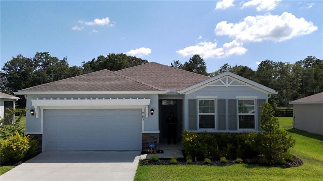 Front exterior of a new home in , Ocala, FL, highlighting curb appeal (Image 23).