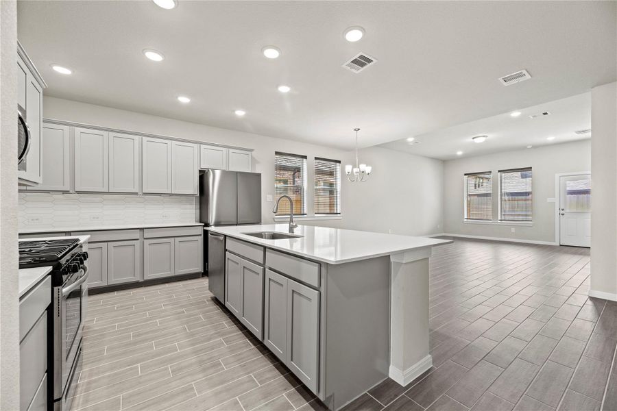 Open concept floorplan with the main dining space located right off the kitchen and connected to the living room.