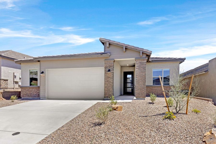 Front exterior of a new home in Saguaro Reserve II, Marana, AZ, highlighting curb appeal (Image 1). Front exterior of a new home in Saguaro Reserve II, Marana, AZ, highlighting curb appeal (Image 1).