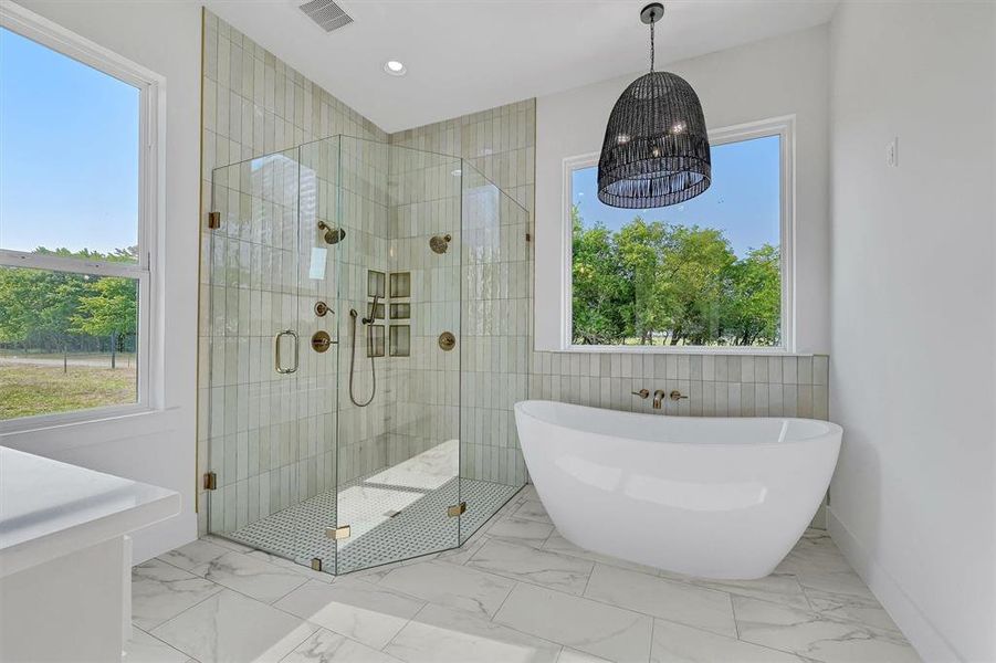 Bathroom featuring tile patterned flooring, tile walls, and independent shower and bath