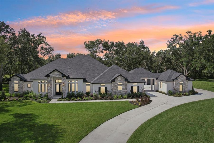 Front exterior of a new home in , Lutz, FL, highlighting curb appeal (Image 28).
