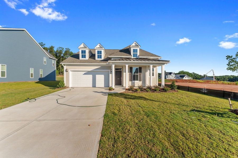 Front exterior of a new home in Cottages at Lake Emory, Inman, SC, highlighting curb appeal (Image 1). Front exterior of a new home in Cottages at Lake Emory, Inman, SC, highlighting curb appeal (Image 1).