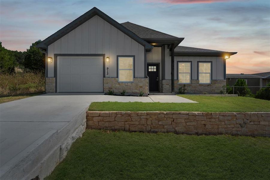 Front exterior of a new home in , Granbury, TX, highlighting curb appeal (Image 2). Front exterior of a new home in , Granbury, TX, highlighting curb appeal (Image 2).