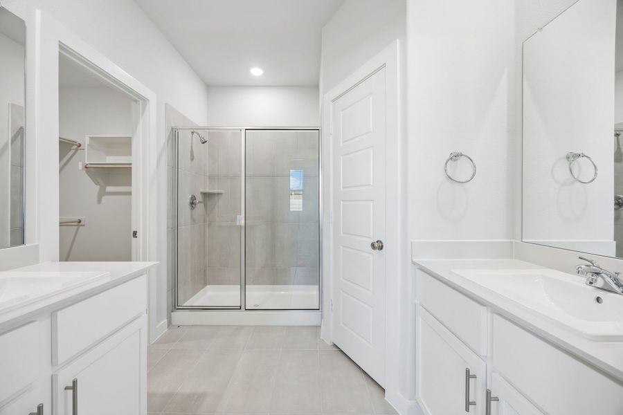 Primary Bathroom in the Birch home plan by Trophy Signature Homes – REPRESENTATIVE PHOTO